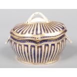 A rare Caughley sauce tureen and cover in the Sevres style. With entwined loop finial, shell moulded