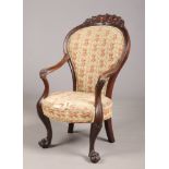 A Regency mahogany armchair in the manner of Thomas Hope. With reeded and acanthus carved arms and