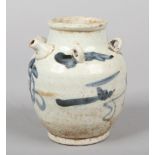 A Chinese provincial Ming Dynasty blue and white wine ewer with loop handles. Painted in