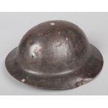A rare World War I War Office pattern Model A Brodie helmet. With original liner and chin strap.