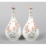 a pair of 19th century Samson Chantilly style octagonal bottle vases and stoppers. Painted in the