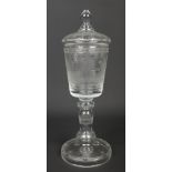 A 20th century Bohemian glass goblet and cover. Etched with a panel depicting a lady playing tennis,