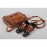 A pair of World War I British Army Officers binoculars in leather case and with strap. Case marked