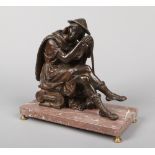 A 19th century French patinated bronze sculpture of a Shepherd. Resting against his crook and seated