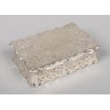 A Victorian silver table snuff box by Hilliard & Thomason. Serpentine in form, with scroll