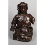 An 18th century Continental carved walnut three quarter length statue of a maiden, 72cm high.