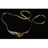 An Italian 18 carat gold and diamond necklet. With white and yellow gold scrollwork pendant set with