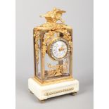 A 19th century French gilt bronze and white marble mantel clock. Surmounted by a pair of birds, with