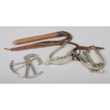 A pair of World War I Cavalry spurs, pair of Gamage's of London boot pulls and a leather whip with
