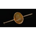 A 9 carat gold mounted intaglio agate bar brooch. Carved with a study of Napoleon crossing the alps,