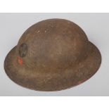 A World War I U.S.A. MKI American Red Cross Brodie helmet. With label and original leather fittings.