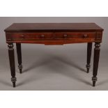A William IV mahogany side table in Gillows style. With dummy drawer fronts and raised on fluted