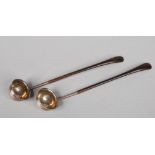 A pair of small George III silver toddy ladles by Edward Mayfield. With carved hardwood handles