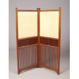 An Edwardian carved mahogany two panel folding screen with upholstered top, 117cm x 92cm.