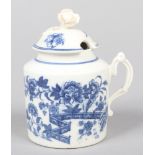 A Caughley mustard pot and cover with flower finial and moulded double scrolling handle. Printed