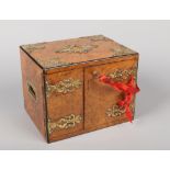 A Victorian burr walnut cigar humidor. With brass gothic strapwork, housing two drawers and with