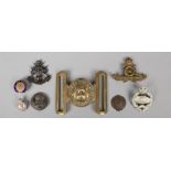 A World War I British military bras belt buckle inscribed dieu et mon droit and various badges