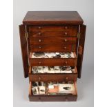 A Victorian figured walnut collectors specimen chest with seven graduated drawers and locking