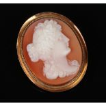 A 9 carat gold mounted oval carved shell cameo brooch. Profile portrait of a maiden, 3.75cm high.