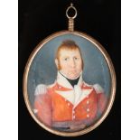 An early 19th century ivory military portrait miniature, gold mounted with milled edge and having