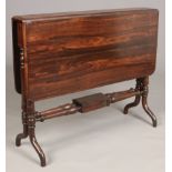 A Victorian rosewood Sutherland table raised on turned supports, 91cm wide.