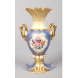 A Rockingham stork-handled vase. Blue and yellow ground with gilt embellishments and a pair of