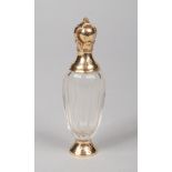 A 19th century Continental faceted glass scent bottle with silver gilt mounts and hinged cover.