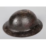 A World War I Model A War Office pattern Brodie helmet with raw edge. Signs of formation markings.