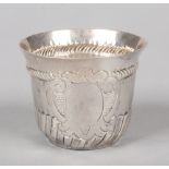 A George II silver caudle cup. With everted rim above a ropetwist band, having plain shield