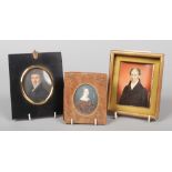 A Regency ivory portrait miniature of a gentleman wearing a cravat and blue overcoat, unsigned.