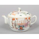 A Chinese Tongzhi (1862-1874) small teapot and cover. Decorated in polychrome enamels with figures