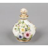 A Rockingham bulbous scent bottle with ridged shoulder and flared neck. Embellished with gilt bands,