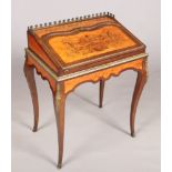 A 19th century kingwood and marquetry ladies writing desk. With ormolu mounts and raised on square