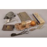 A group lot of collectables to include ornate white metal desk top paper clip, old golf balls etc.