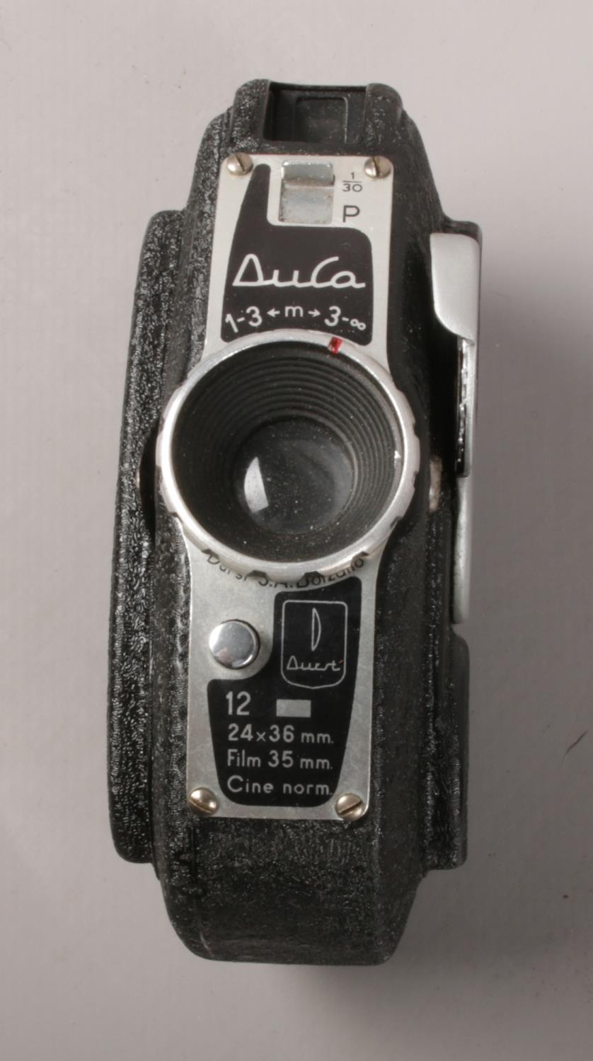 A collection to include Durst Duca 35mm camera with case, Two Perthshire paperweights, wooden - Image 2 of 2