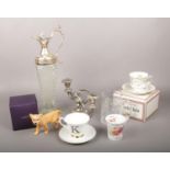 A mixed group to include Beswick ceramic lioness, cut glass carafe, silver plate candelabra etc.