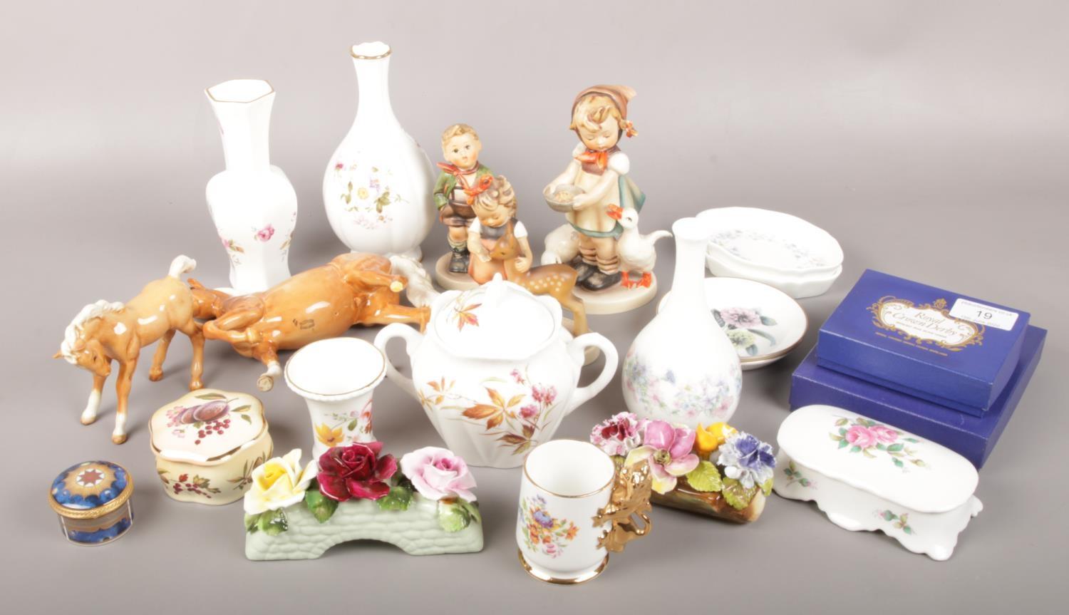 A group lot of ceramics to include Beswick horses, Goebel figures by M.J Hummel, Royal Crown