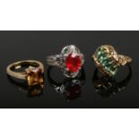 Three 18ct gold gem set rings including a white gold example set with a large padparadscha