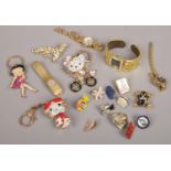 A box of costume jewellery to include Hello Kitty, Betty Boo keyrings ladies quartz wristwatches,