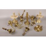 A collection of brass wares to include candlesticks, ornate wall lights etc.