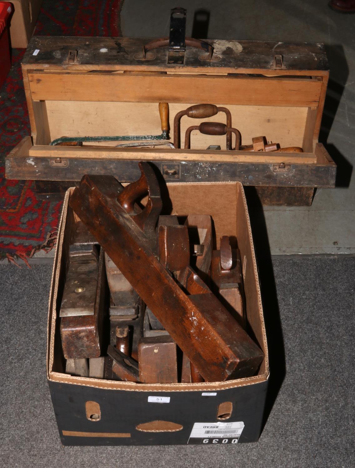 A vintage carpenters tool chest and contents of wood working tools, along with a box of wood planes.
