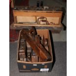 A vintage carpenters tool chest and contents of wood working tools, along with a box of wood planes.