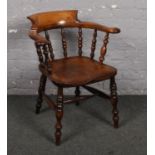 A 19th century smokers bow armchair.