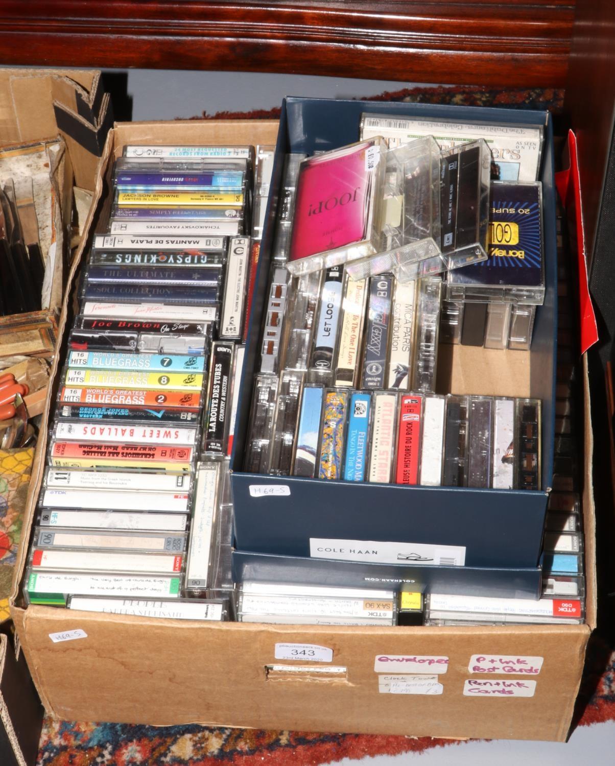 Two boxes of cassette tapes to include Fleetwood Mac, Take That etc.