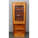 A stained pine corner cupboard with reclaimed leaded glaze glass panel stencilled Smoke room, Market