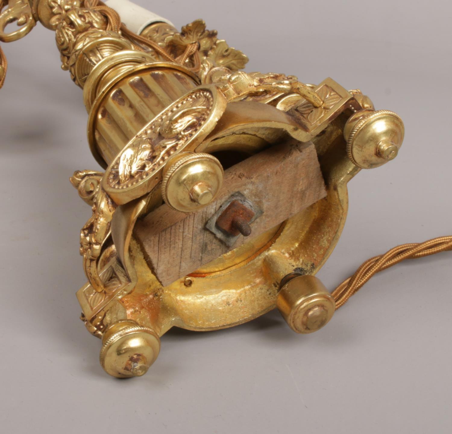 A French gilt bronze three branch tablelamp. With leaf moulded sconces and raised on a column plinth - Image 5 of 5
