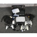 A Playstation One gaming console along with controllers and other accessories etc.