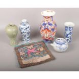 A group lot of orientalwares ceramics to include teapot, vases, silk etc. Chips to sleeve vase.