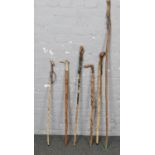 A collection of wood walking sticks, varying heights 83cm to 146cm, good