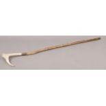 A bone handle walking stick.